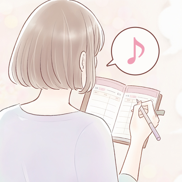 女性がスケジュール帳に書き込んでいるイラスト
